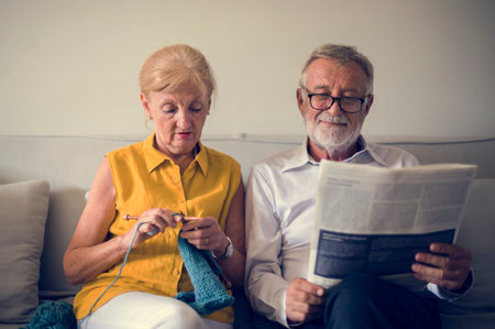 Senior Couple Read Newspaper Crochet