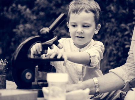 Little Kid Experimenting Science Microscope