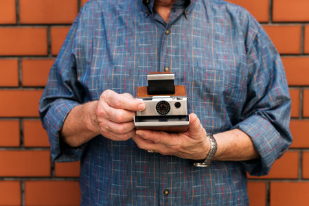 Person holding a retro camera