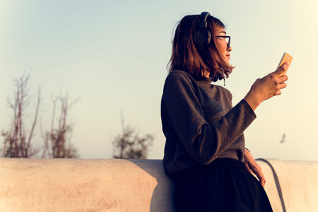 Woman Using Mobile Phone Outdoor