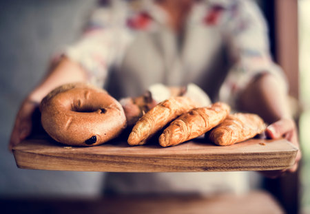 Woman with bread at pastry shop order