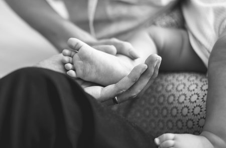 Father and mother are taking care of their child.