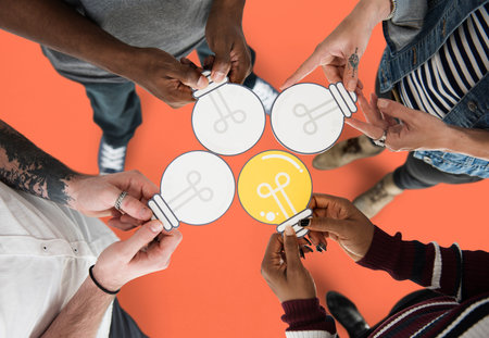 People Holding Paper Light Bulb Icon