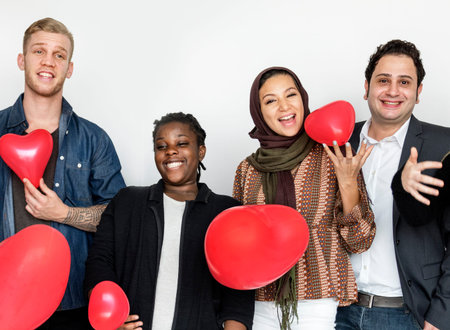 Group of Diverse People Holding Heart Balloons Cheerful