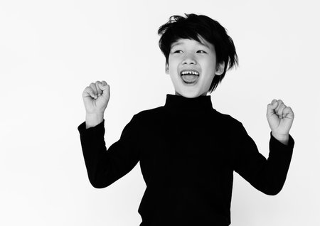 Asian boy is in a studio shoot.