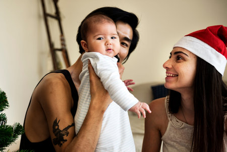 Father and mother are taking care of their child.
