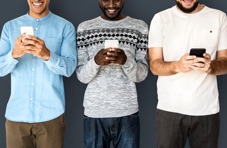 Happiness group of men smiling and conneted by mobile phone