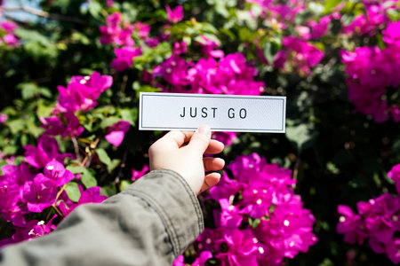 People Hand Holding Paper with Bougainvillea Background