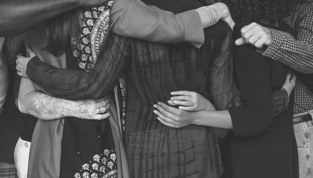 Group of people huddle together