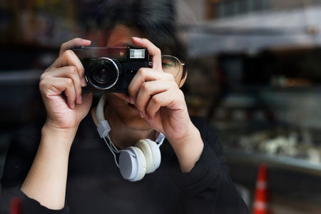 Young asian boy holiday leisure taking photo