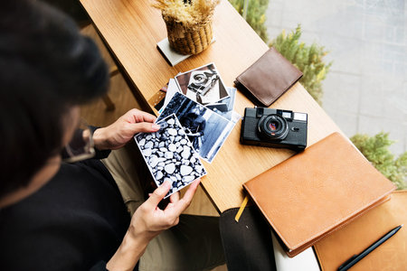 Young photographer selecting images photo