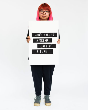 Woman holding target plan banner