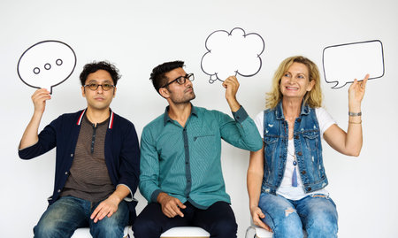 People Holding Paper Speech Bubble Icon