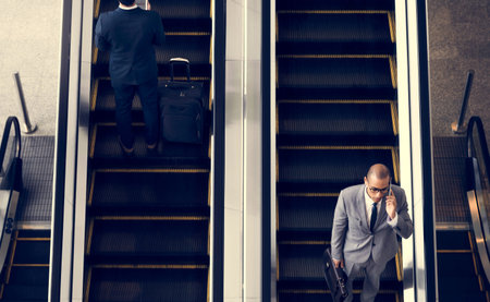 Business Men Escalator Talk Mobile