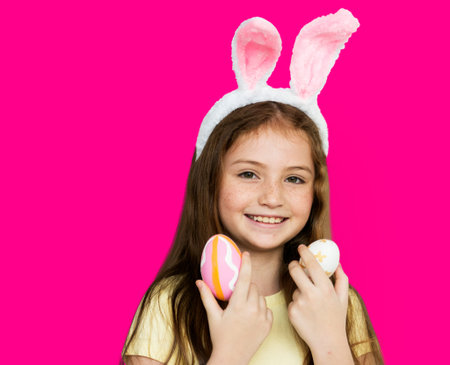Children with bunny hairband and easter eggs