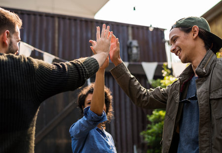 Group of people high five for support and achievement