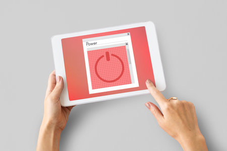 Hands working on digital device network graphic overlay