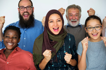 Diverse group of people smiling and celebrating