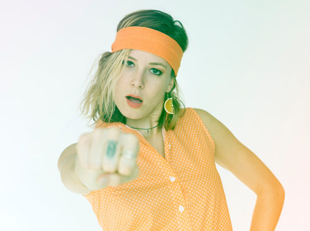 Woman standing and showing a punch intensely