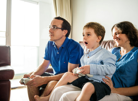 Family playing video game together on weekend holiday