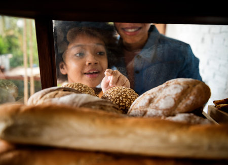 Customer Buying Fresh Baked Bread in Bakery Shop