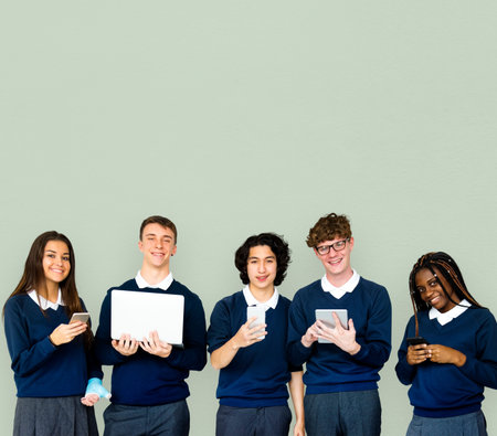 Group of Diverse Students Using Digital Devices Studio Portrait
