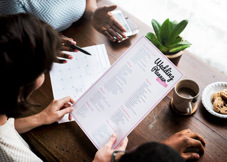 Hands Holding Wedding Planner Checklist Information Preparation