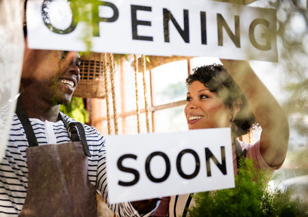 Couple Showing Opening Soon Paper Sign