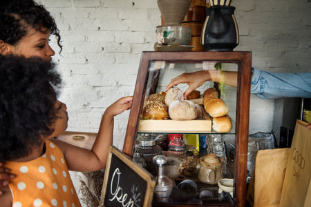 Customer Buying Fresh Baked Bread in Bakery Shop