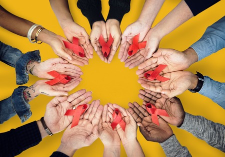 Hands holding red ribbons