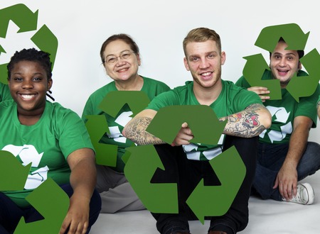 Ecology group of people smiling and holding recycle symbol