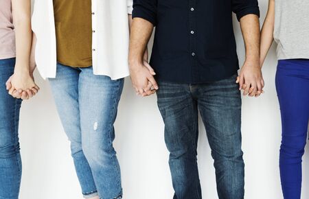 Group of people holding hand together