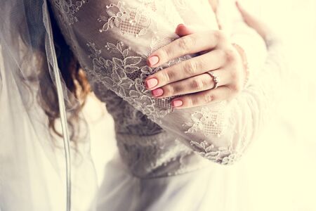 Attractive Beautiful Bride Showing Engagement Wedding Ring on Hand
