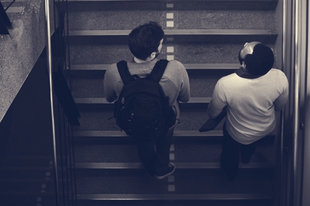 People Talking at Stairway During Break Time