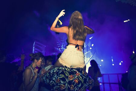 People Enjoying Live Music Concert Festival
