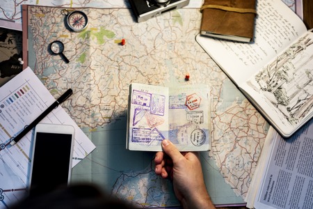 Aerial of hands planning about travel trip and journey