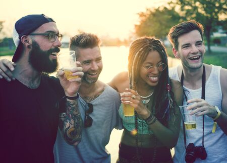 Group of Friends Drinking Beers Enjoying Music Festival Together