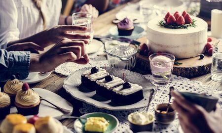 People celebrate birthday party with cake