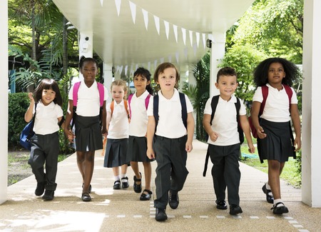 Group of diverse kindergarten students walking together