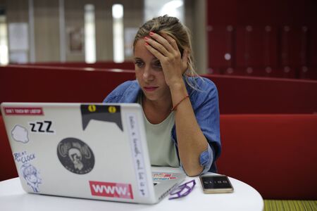 Woman working on laptop networking technology