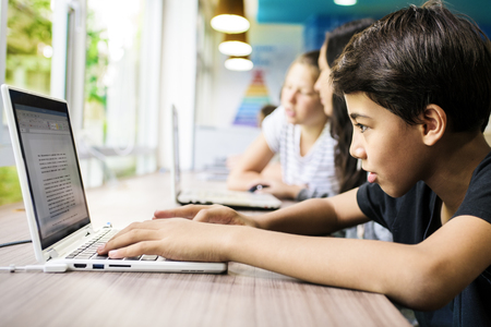 Young man using computer laptop