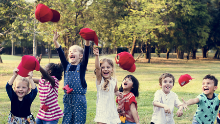 Group of Diverse Kids Playing at the Field Together