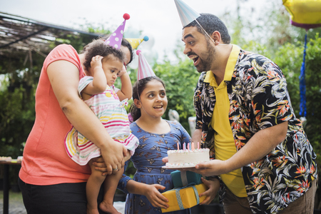 Little girl celebrate birthday partt with family