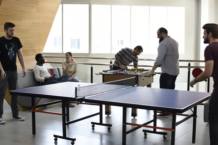 People break playing table tennis relax