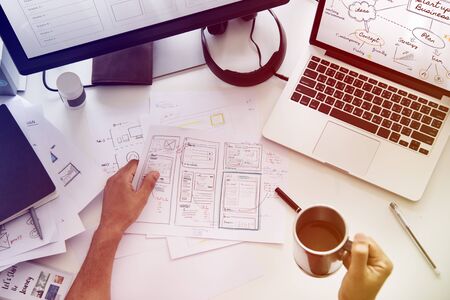 A Man Working Plan Diagram On A White Table