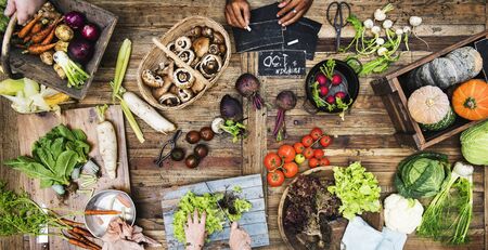 Aerial view of fresh organic various vegetable on wooden table