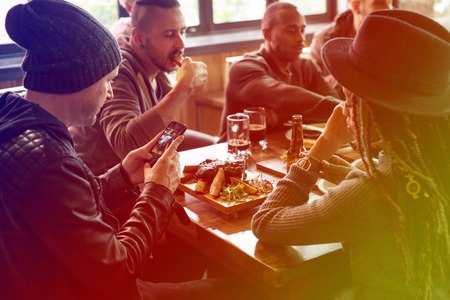 Foto de Group of friends have a meal at restaurant - Imagen libre de derechos