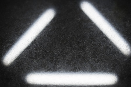 White triangel lines paint on black background