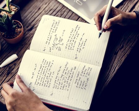 Hand Holding Pen Write Travel Plan Note