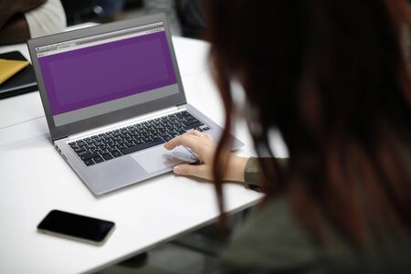 Woman working on laptop networking technology